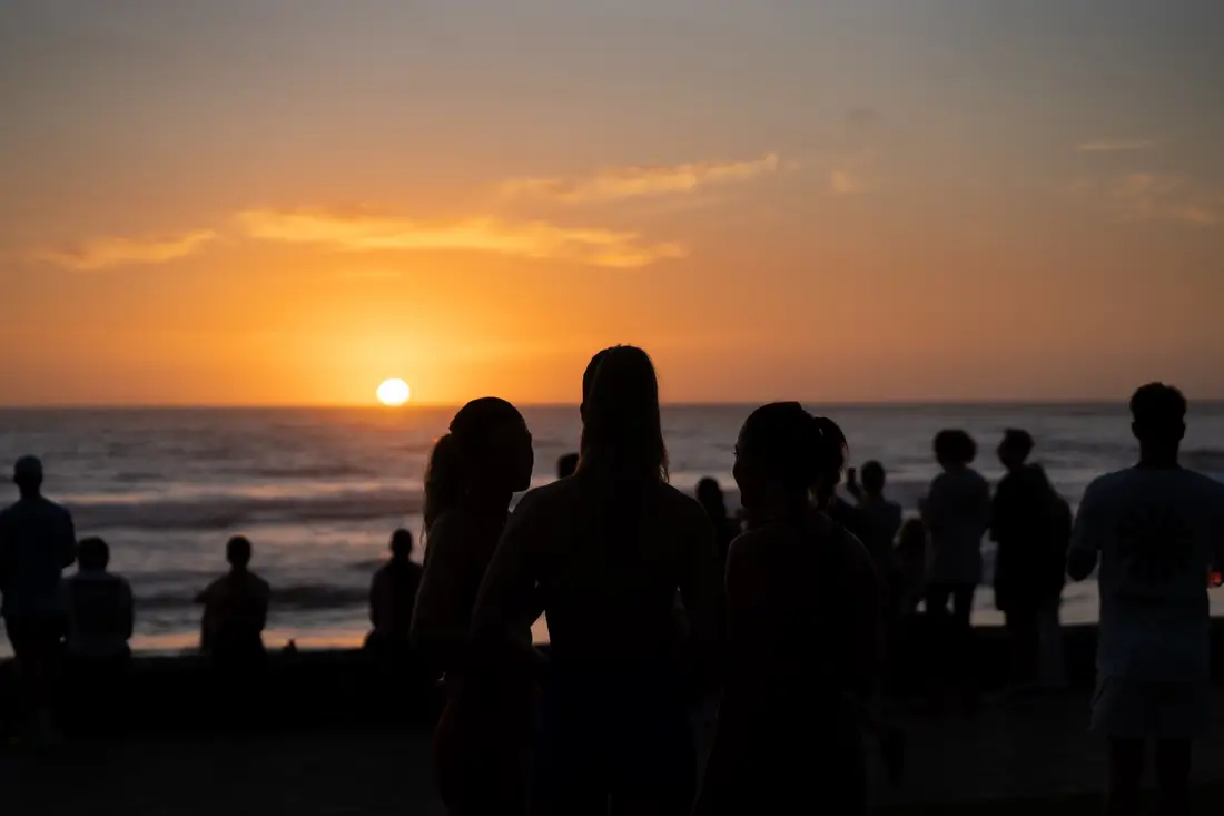 Runners along the Manly beachfront at sunrise